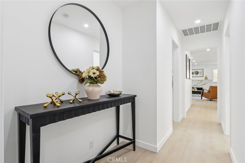 11060 Vanda Way Sun Valley, CA 91352 - Photo 22 of 43 a dining room with furniture and mirror