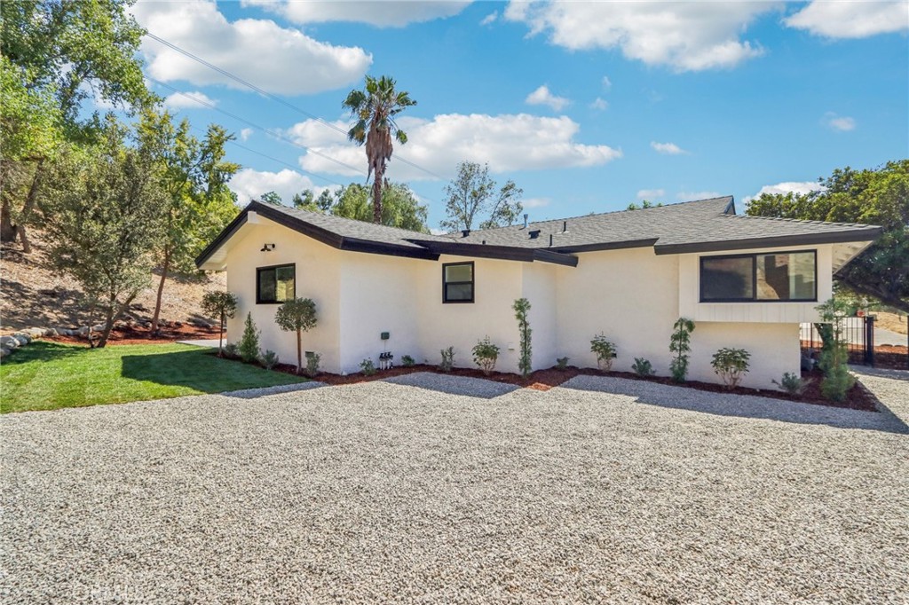 11060 Vanda Way Sun Valley, CA 91352 - Photo 24 of 43 a front view of a house with garden