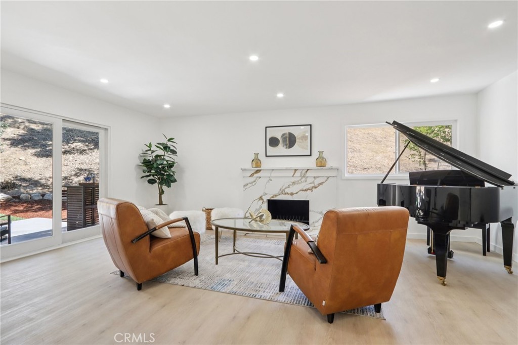 11060 Vanda Way Sun Valley, CA 91352 - Photo 5 of 43 a living room with furniture a fireplace and a flat screen tv