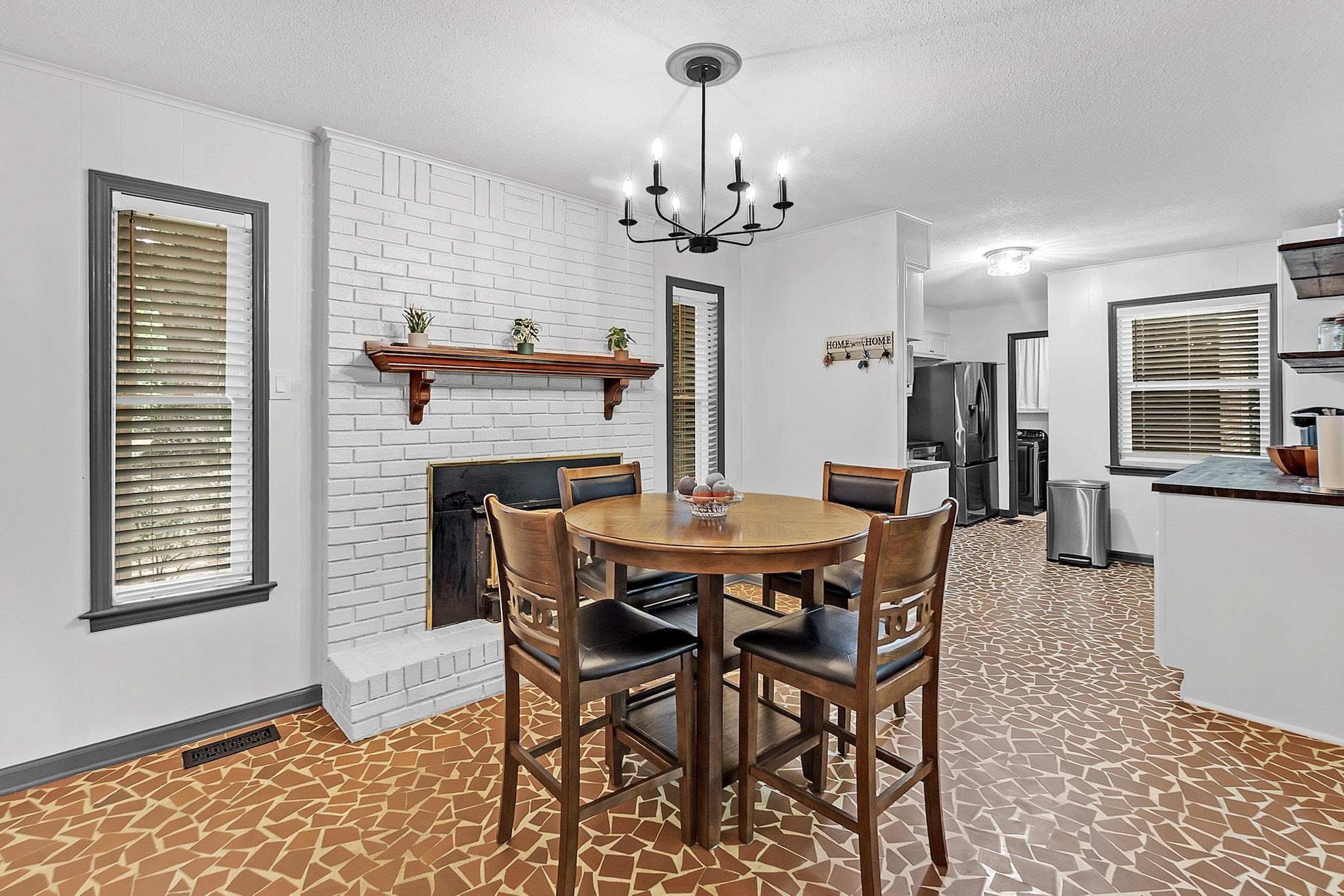 2234 Highway 301 Hernando, MS 38632 - Photo 13 of 27 a view of a dining room with furniture and chandelier