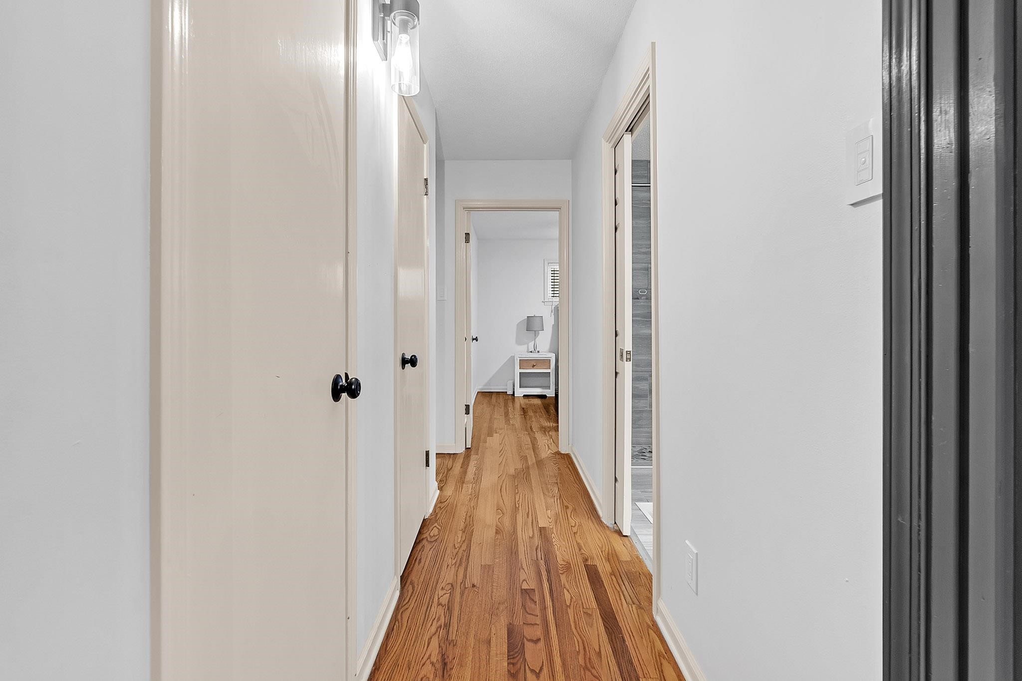 2234 Highway 301 Hernando, MS 38632 - Photo 14 of 27 a view of a hallway with wooden floor and staircase