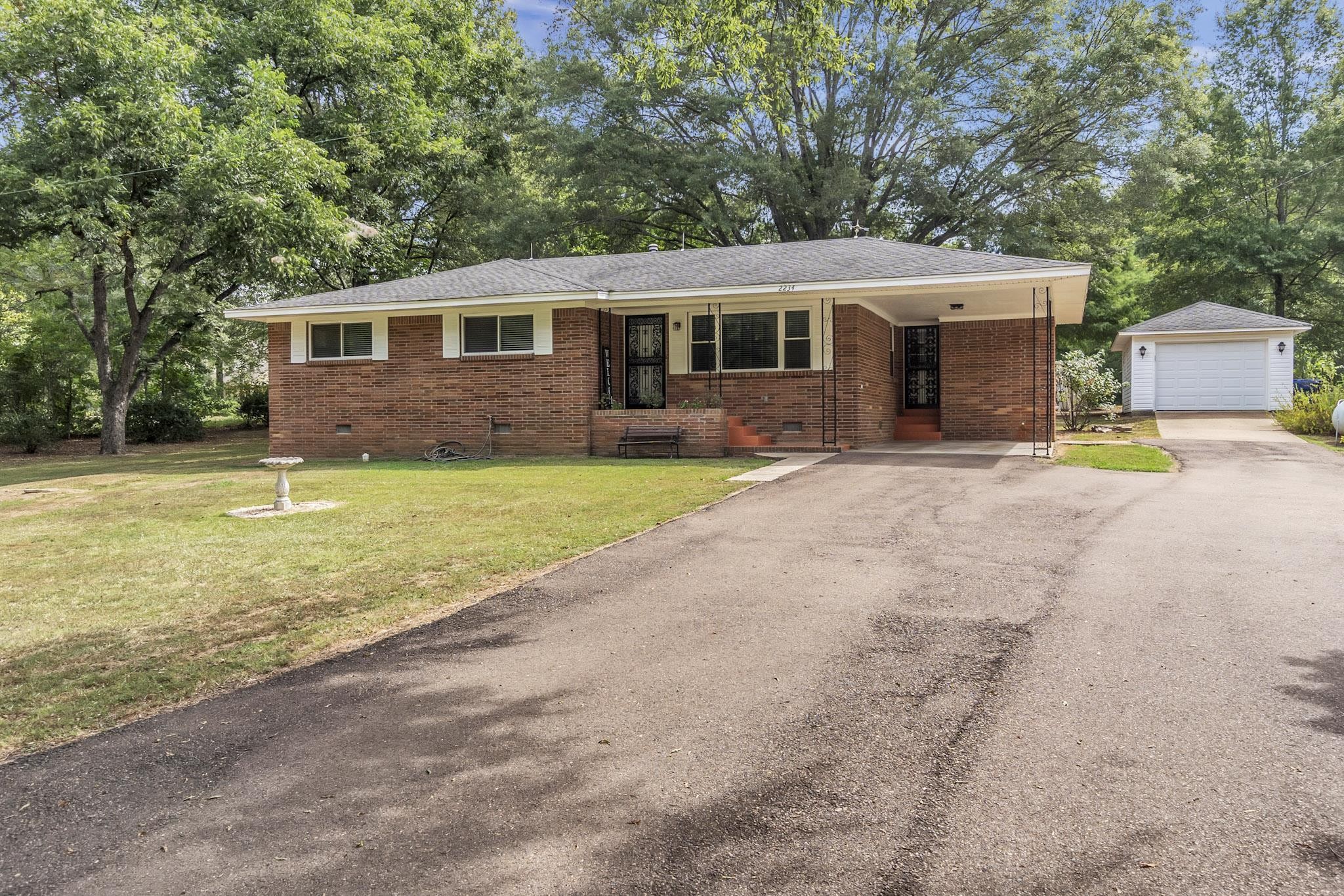 2234 Highway 301 Hernando, MS 38632 - Photo 3 of 27 a view of a house with a yard and large tree