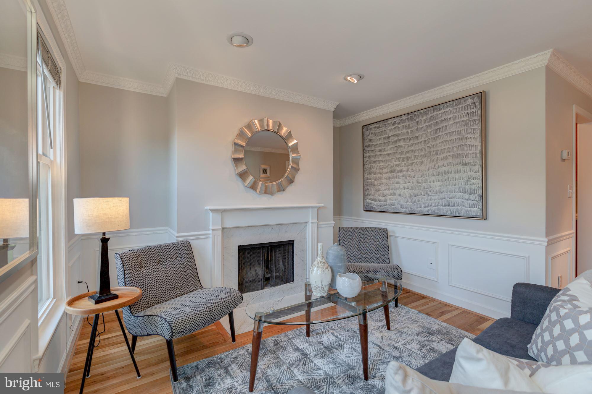1801 T Street Northwest, Unit C Washington, DC 20009 - Photo 2 of 16 a living room with furniture and a fireplace