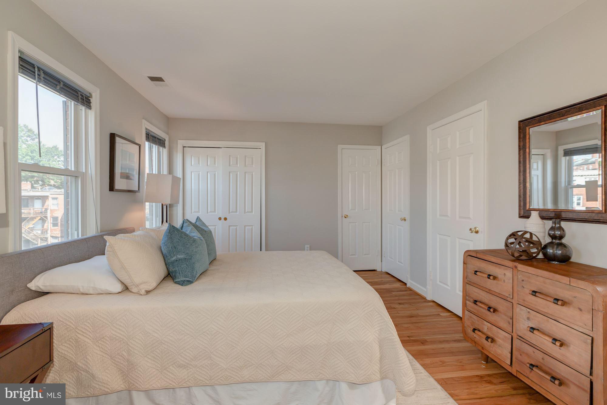1801 T Street Northwest, Unit C Washington, DC 20009 - Photo 11 of 16 a bedroom with a bed and window