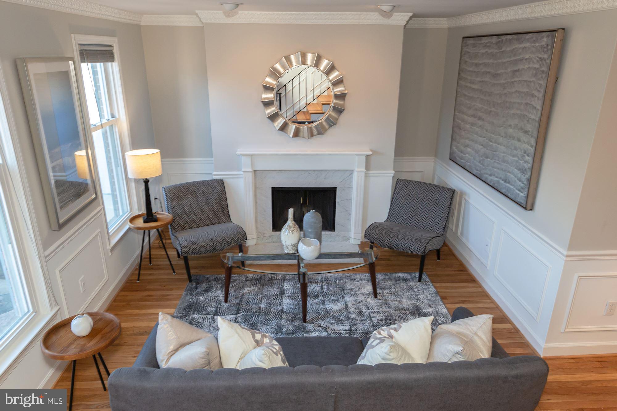 1801 T Street Northwest, Unit C Washington, DC 20009 - Photo 4 of 16 a living room with furniture and a fireplace