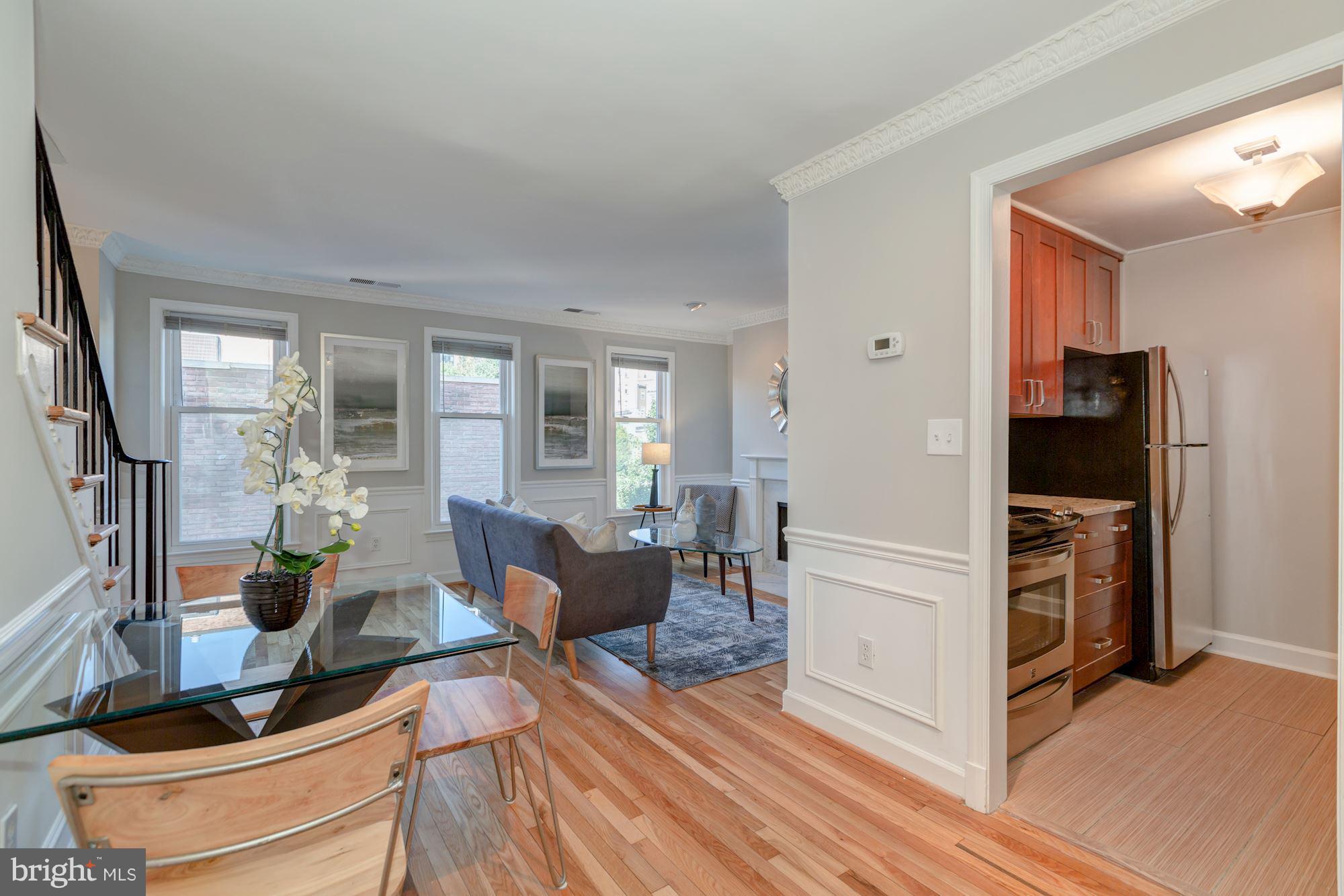 1801 T Street Northwest, Unit C Washington, DC 20009 - Photo 6 of 16 a living room with furniture and a flat screen tv