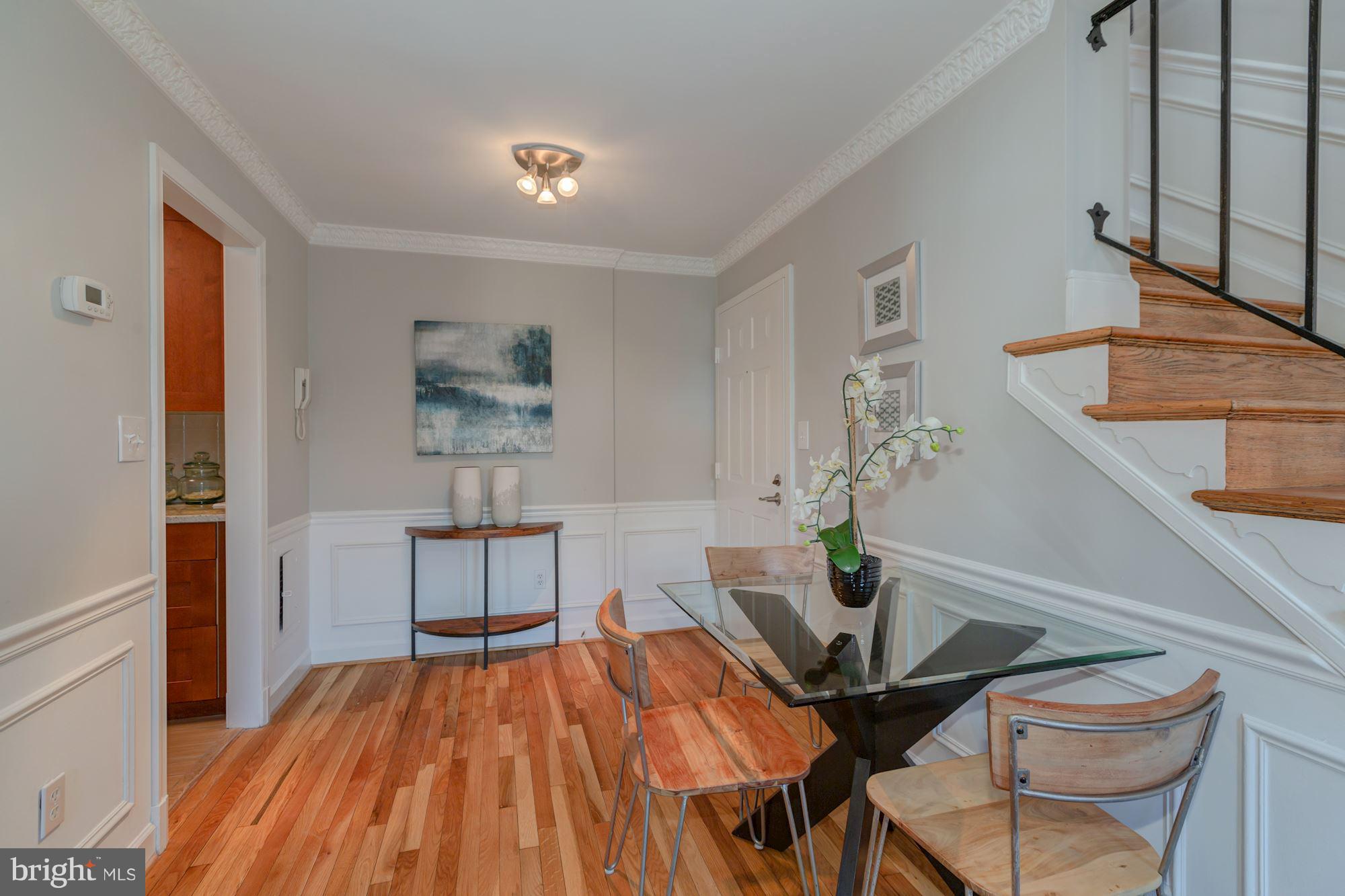 1801 T Street Northwest, Unit C Washington, DC 20009 - Photo 7 of 16 a living room with furniture and wooden floor