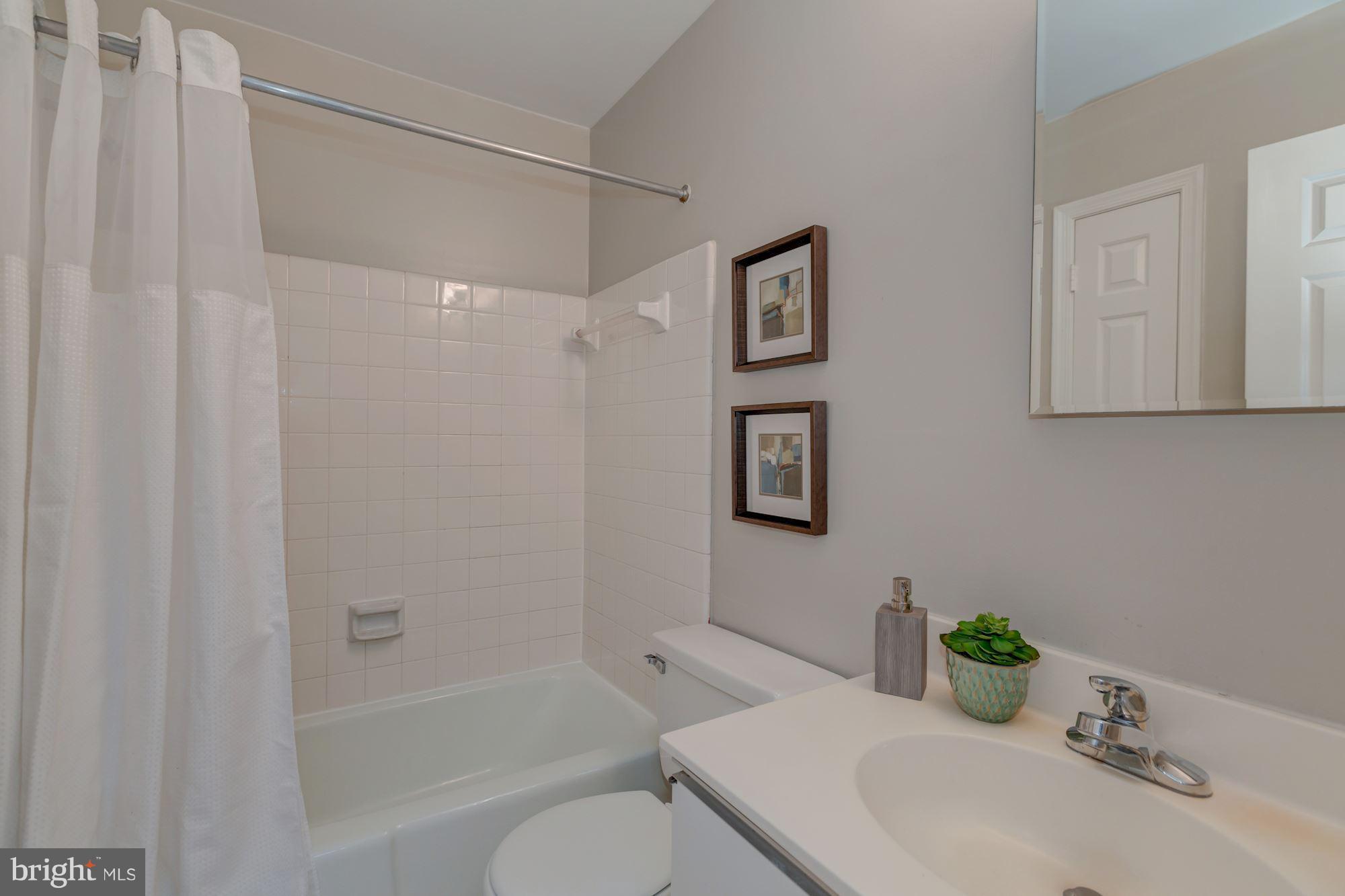 1801 T Street Northwest, Unit C Washington, DC 20009 - Photo 9 of 16 a bathroom with a sink toilet and shower