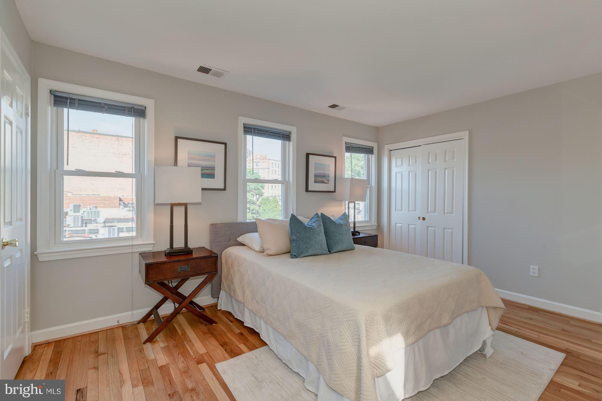 1801 T Street Northwest, Unit C Washington, DC 20009 - Photo 10 of 16 a bedroom with a bed and a window
