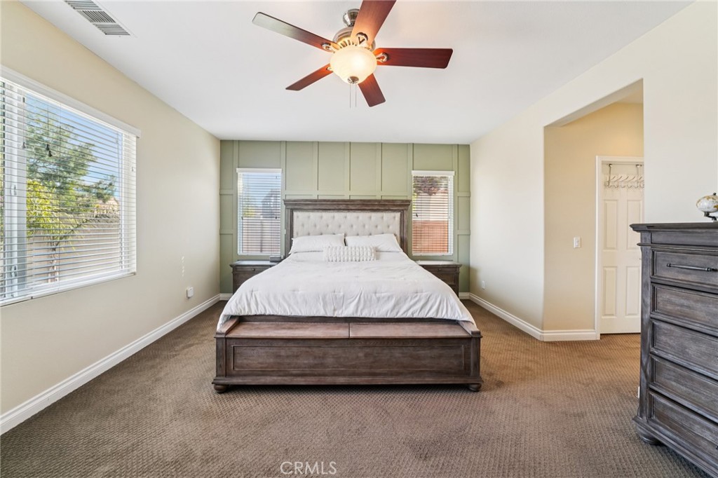 28552 Rustic Glen Street Menifee, CA 92584 - Photo 18 of 48 Spacious primary bedroom retreat with plenty of natural light