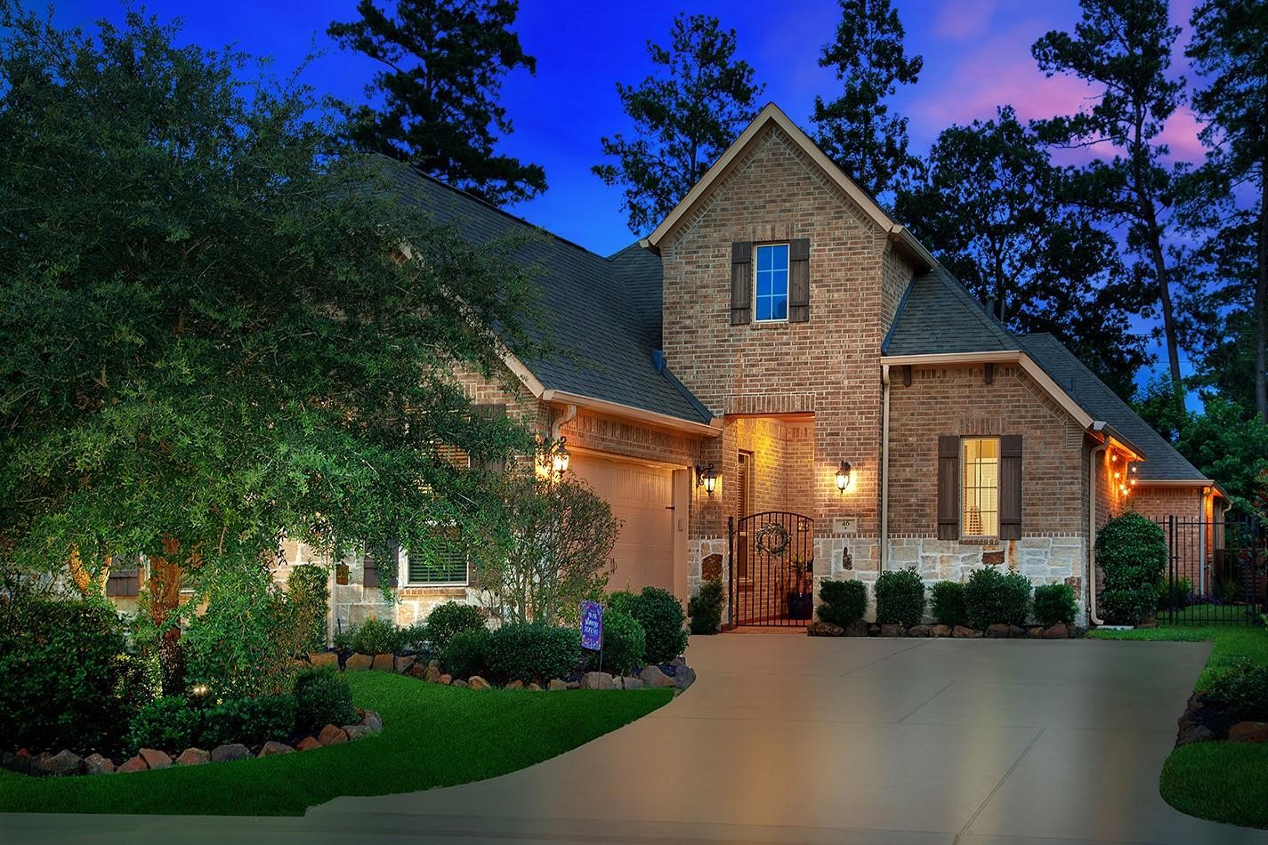 46 Sundown Ridge Place Tomball, TX 77375 - Photo 1 of 46 a front view of a house with a yard and green space