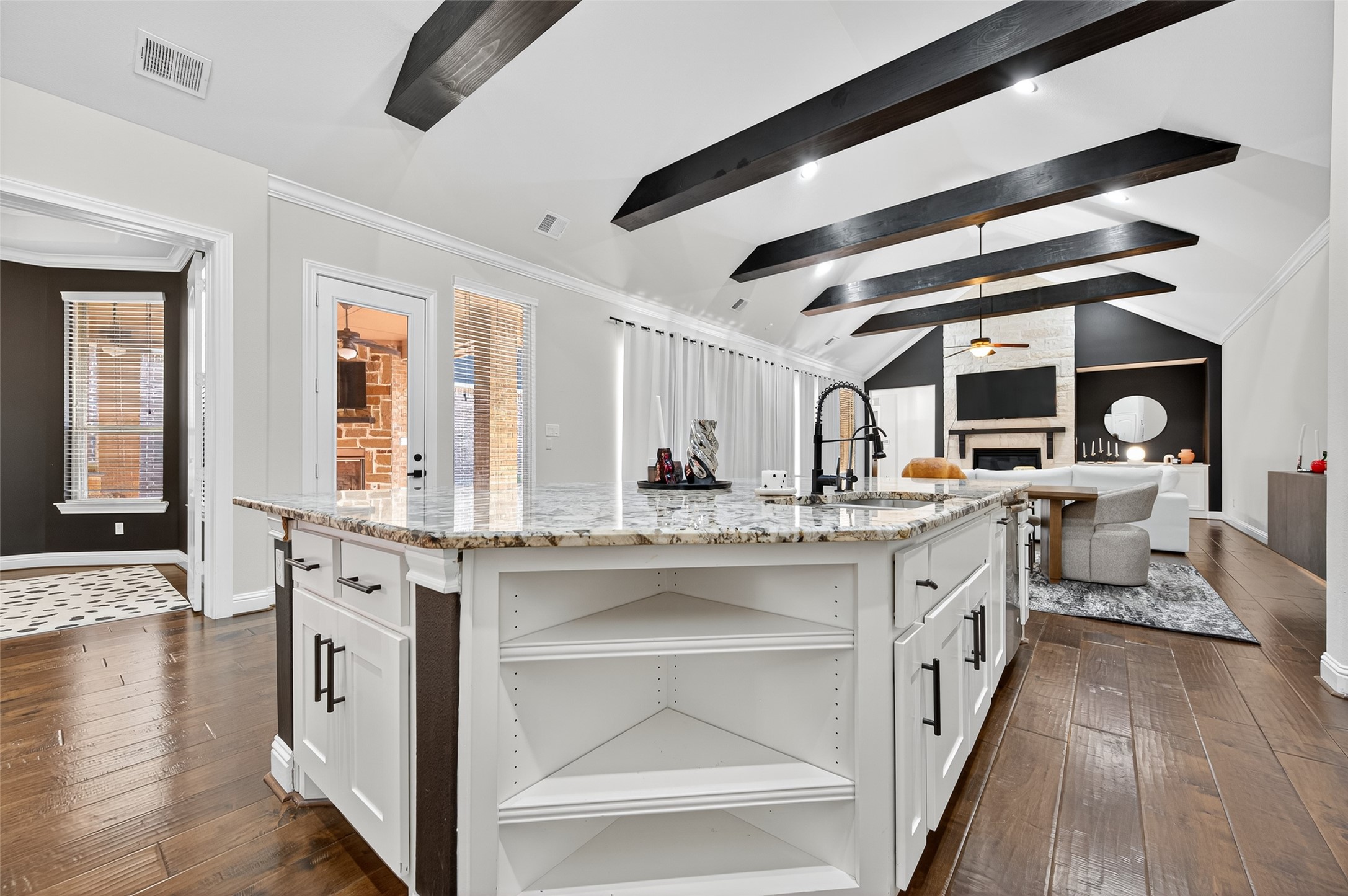 46 Sundown Ridge Place Tomball, TX 77375 - Photo 14 of 46 a large white kitchen with stainless steel appliances granite countertop a stove and a wooden floors