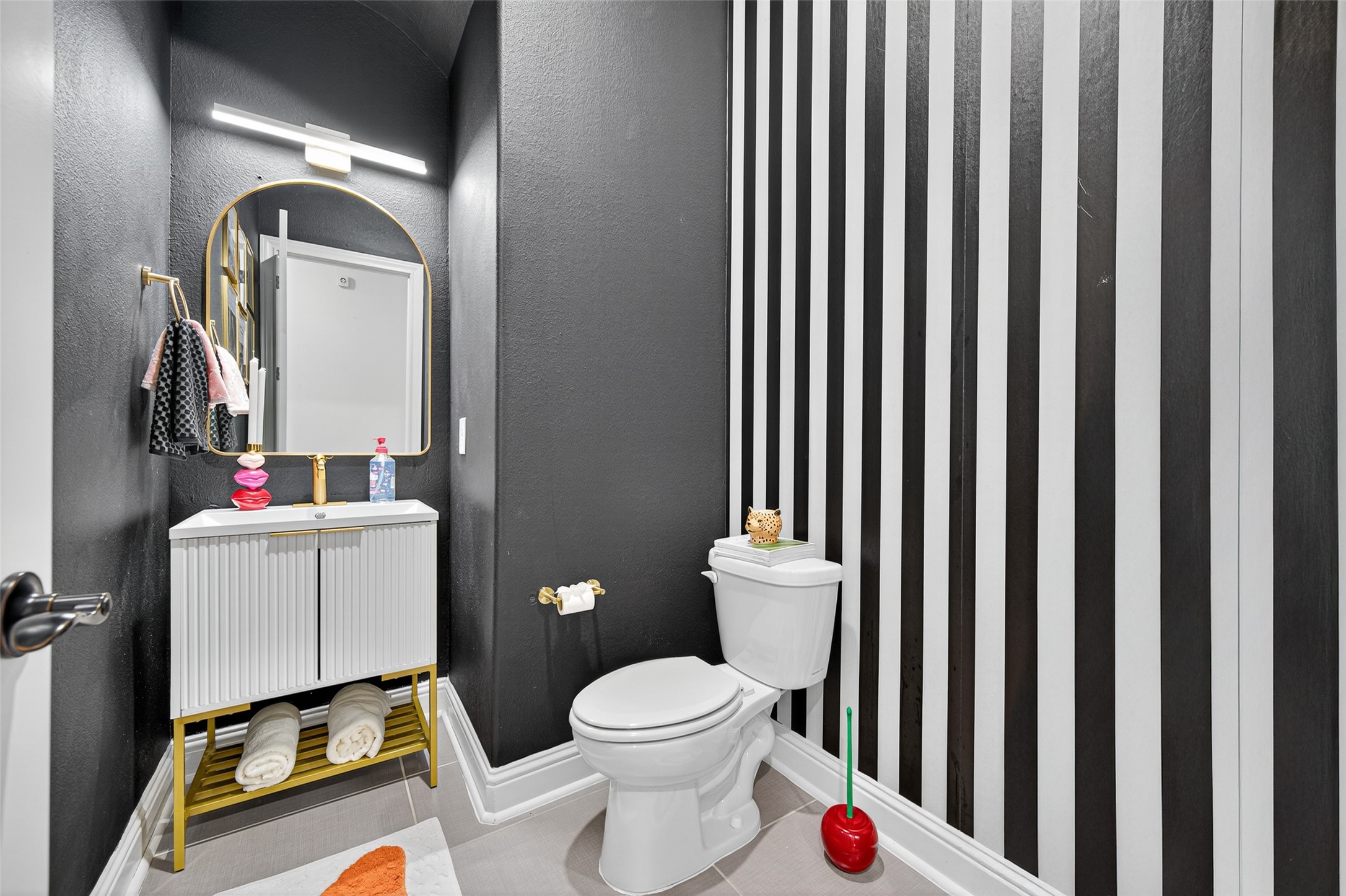 46 Sundown Ridge Place Tomball, TX 77375 - Photo 16 of 46 a white toilet sitting next to a bathroom sink