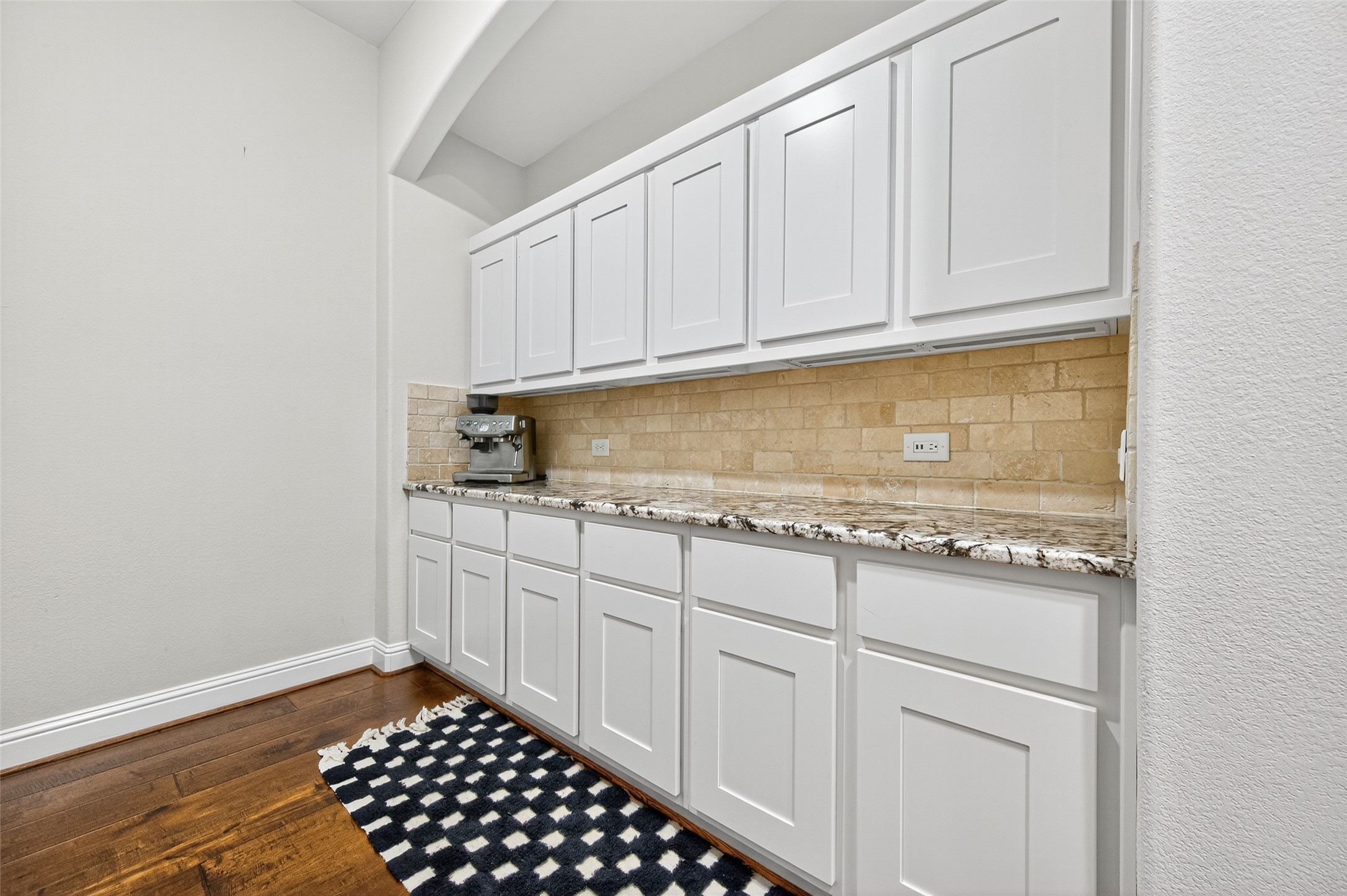 46 Sundown Ridge Place Tomball, TX 77375 - Photo 18 of 46 a kitchen with granite countertop white cabinets and sink