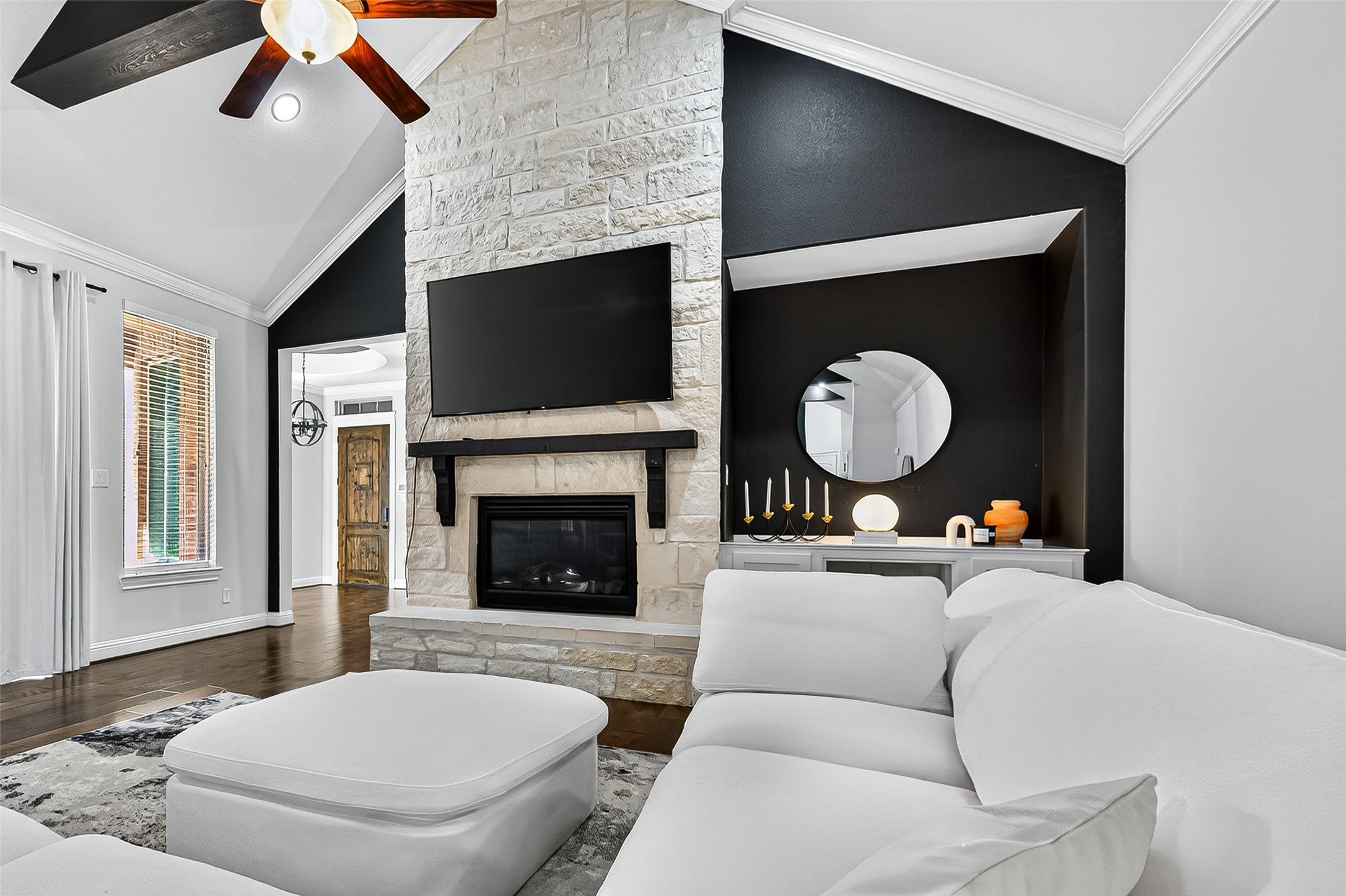 46 Sundown Ridge Place Tomball, TX 77375 - Photo 6 of 46 a living room with furniture a flat screen tv and a fireplace