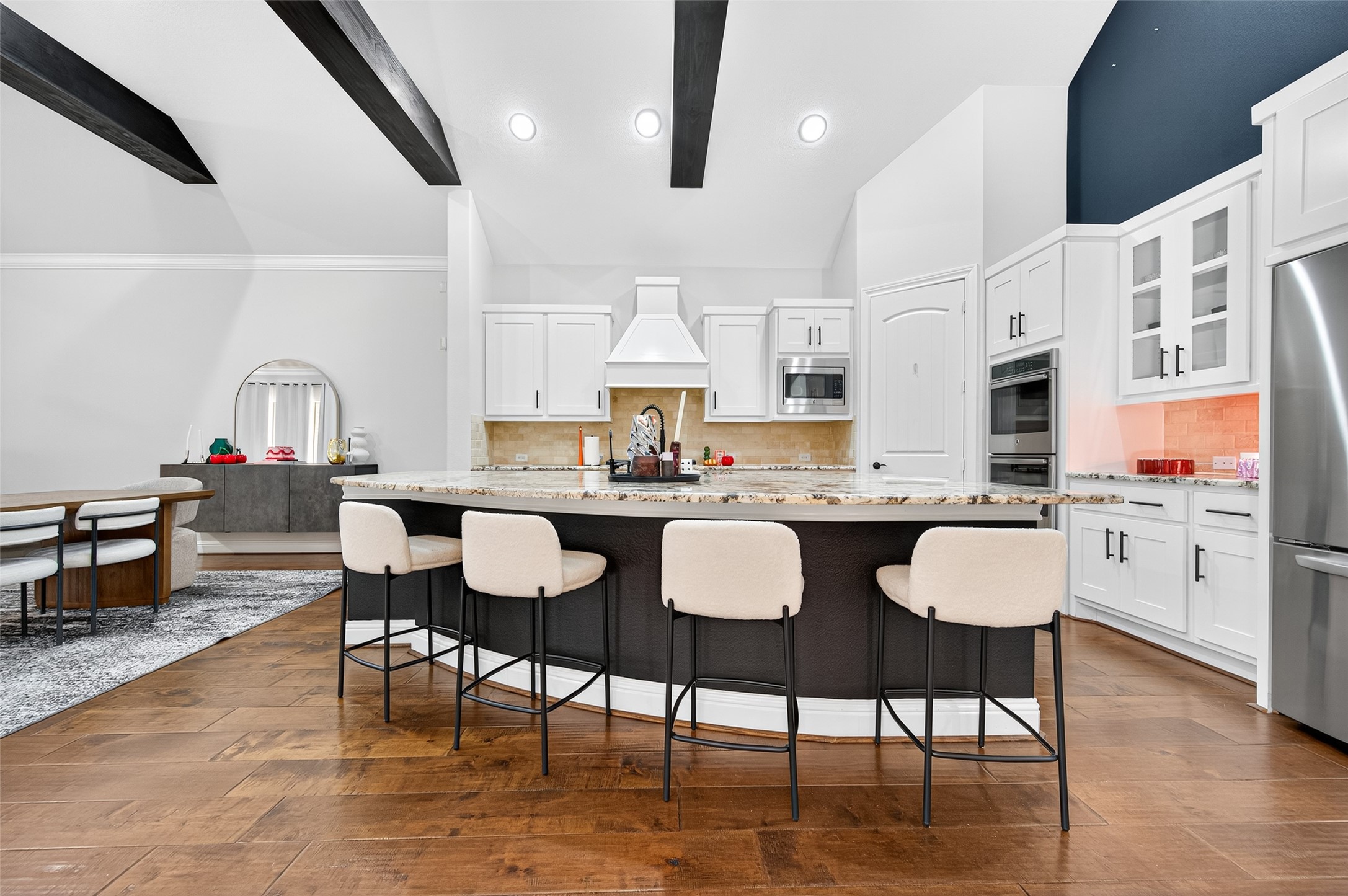 46 Sundown Ridge Place Tomball, TX 77375 - Photo 10 of 46 a view of kitchen with breakfast area and windows