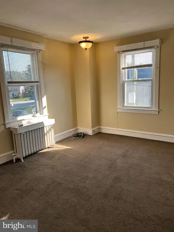 en empty room with windows