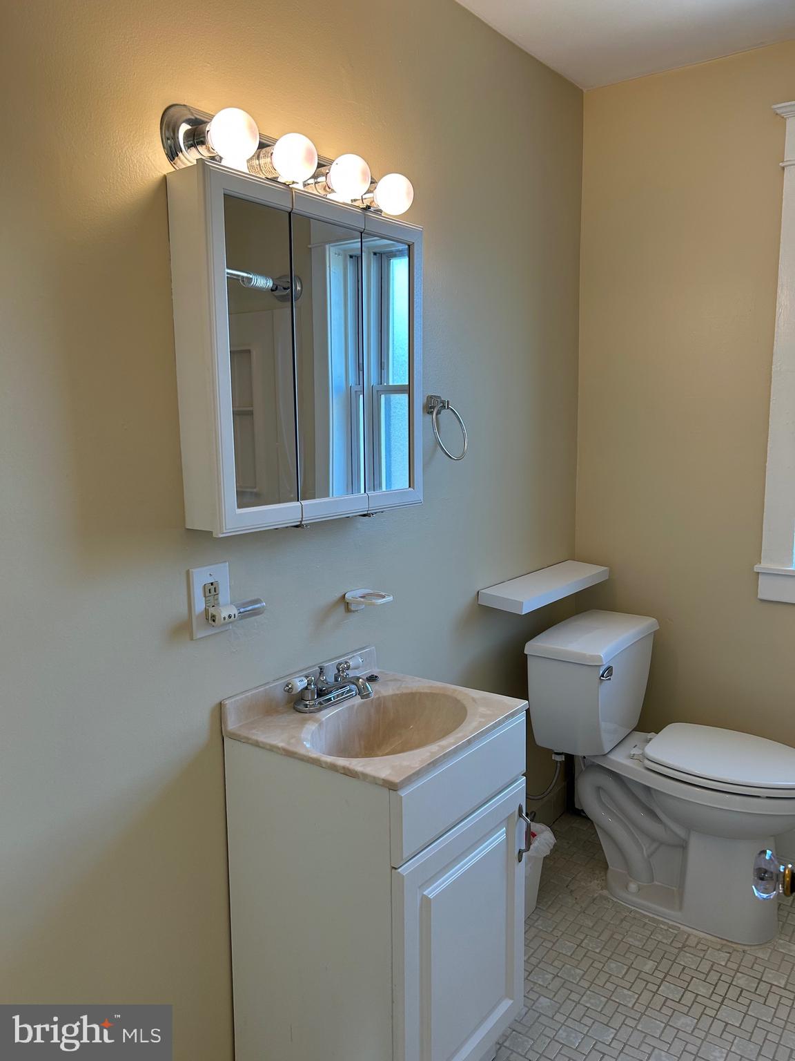 1005 Weller Avenue Havertown, PA 19083 - Photo 8 of 11 a bathroom with a toilet sink and mirror