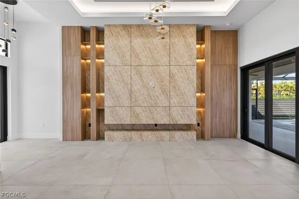 a bedroom with a bed and a potted plant on the dresser