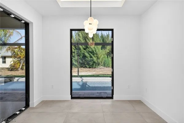 a view of an empty room with glass door