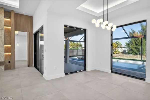 a bathroom with a double vanity sink a mirror and a bathtub