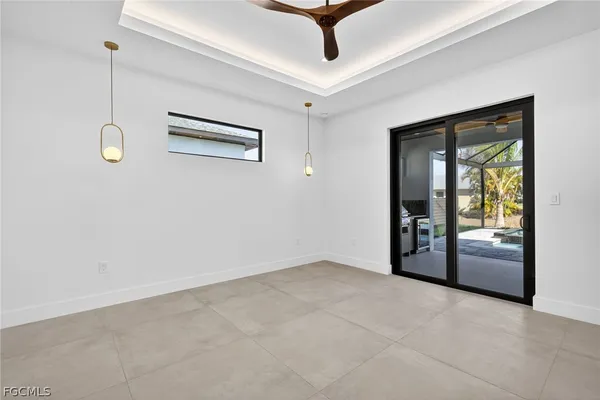 a view of a floor with a floor to ceiling window and wooden floor