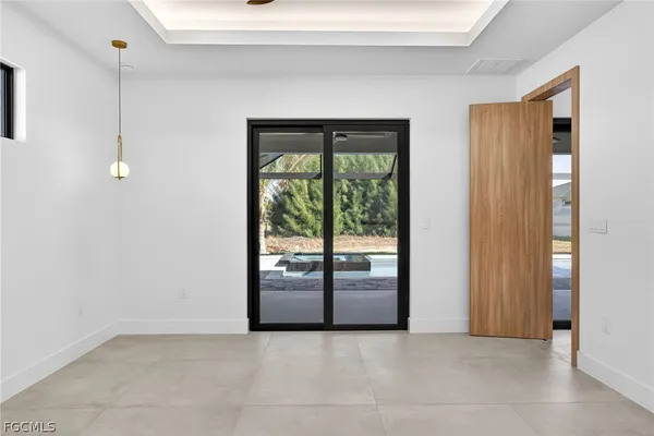 a view of a big house with a big yard and large trees