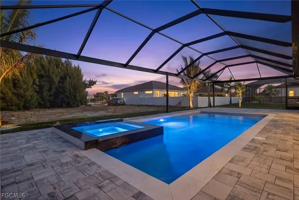 a view of swimming pool with a patio