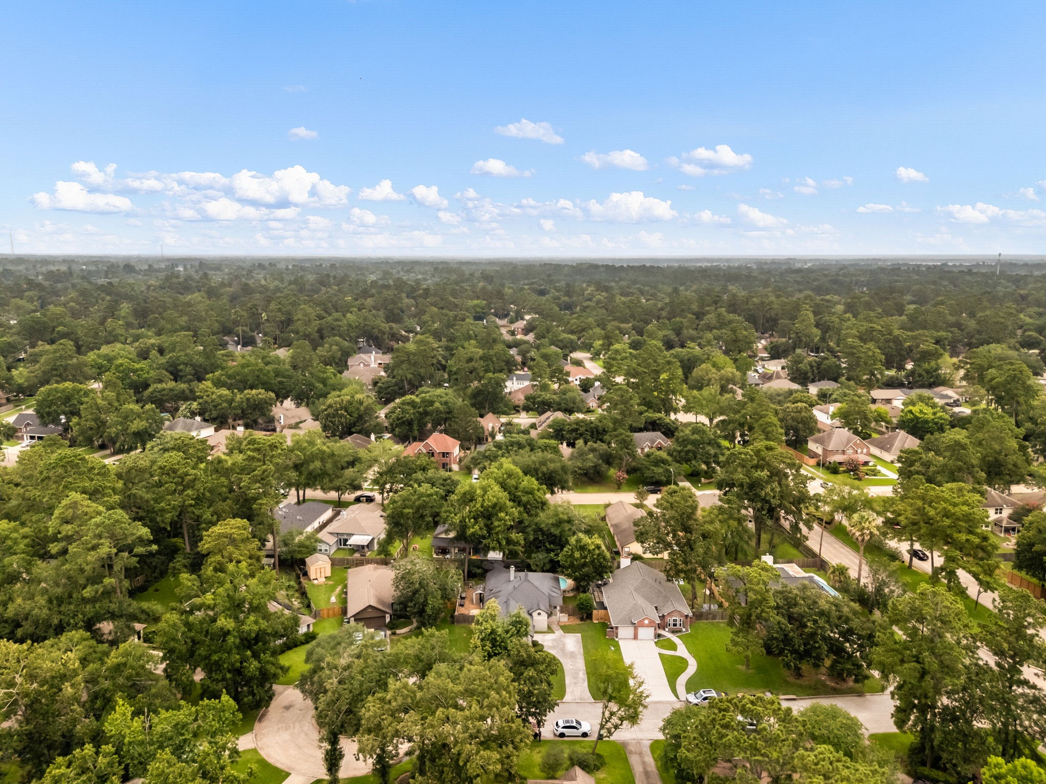 1915 Mercoal Drive Spring, TX 77386 - Photo 39 of 50 Expansive aerial view of the surrounding community and nearby green spaces.