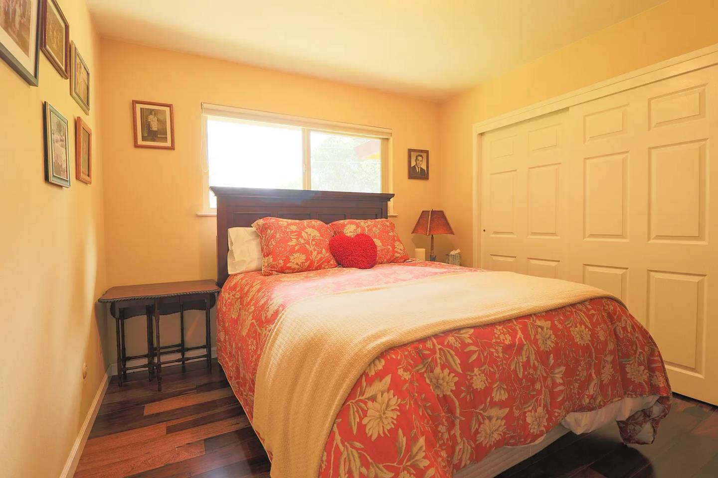 6600 Guerneville Road Sebastopol, CA 95472 - Photo 7 of 13 a bedroom with a bed and wooden floor