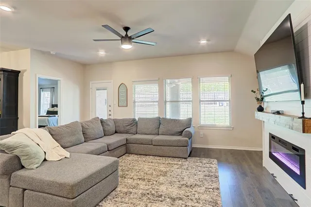 a living room with furniture and a large window