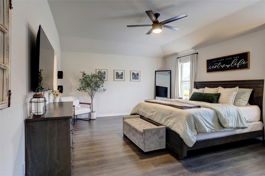 2213 Rosemary Way Anna, TX 75409 - Photo 17 of 27 a spacious bedroom with a bed a couch and a potted plant