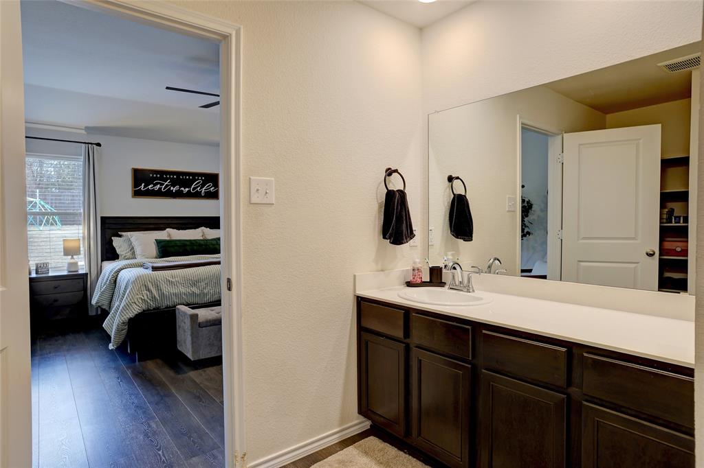 2213 Rosemary Way Anna, TX 75409 - Photo 19 of 27 a en suite bathroom with a granite countertop double vanity and a mirror