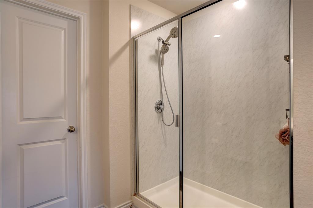 2213 Rosemary Way Anna, TX 75409 - Photo 20 of 27 a bathroom with a shower and a glass door
