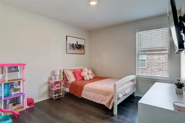 a bathroom with a sink vanity mirror and toilet