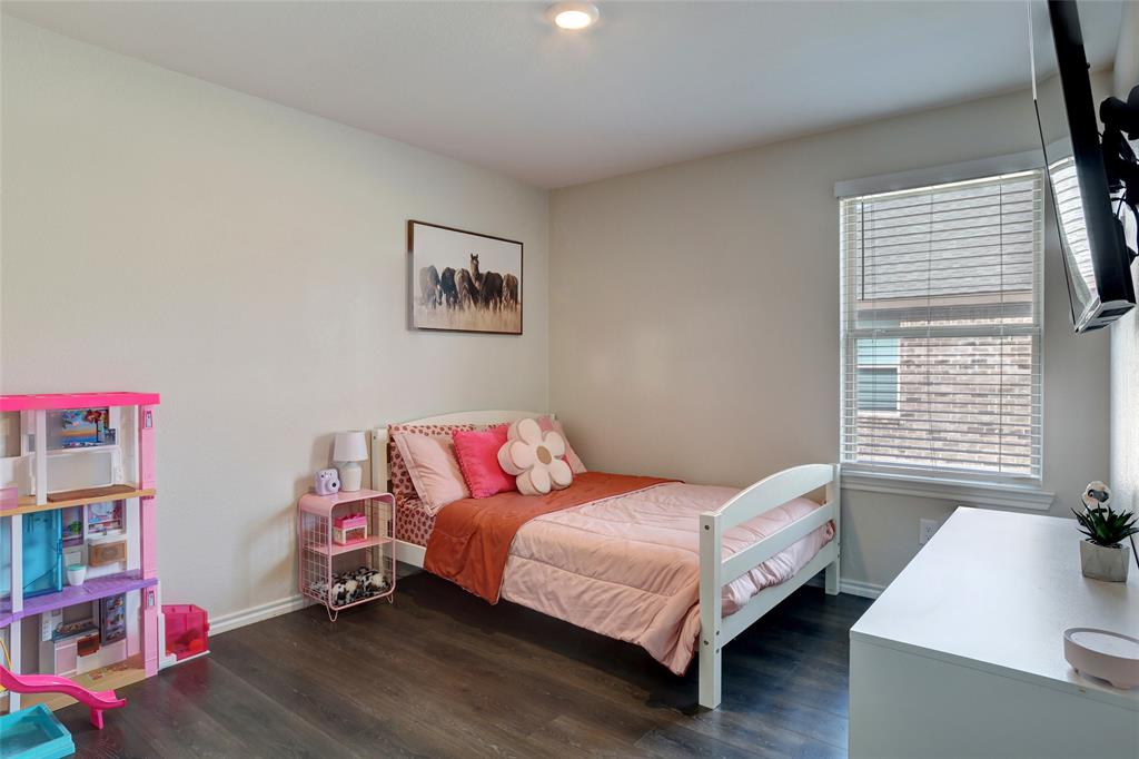 2213 Rosemary Way Anna, TX 75409 - Photo 5 of 27 a bedroom with a bed and a window