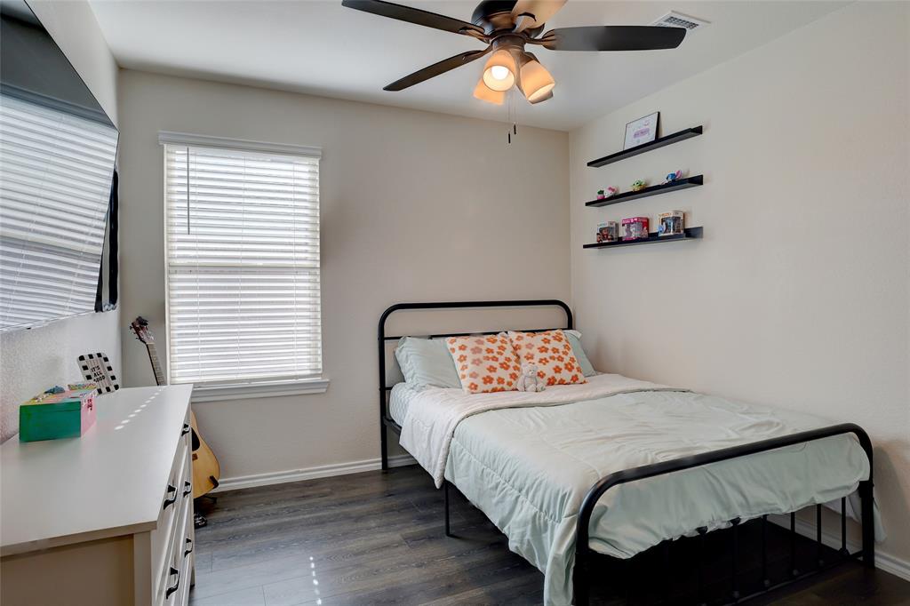 2213 Rosemary Way Anna, TX 75409 - Photo 7 of 27 a bedroom with a bed and a window