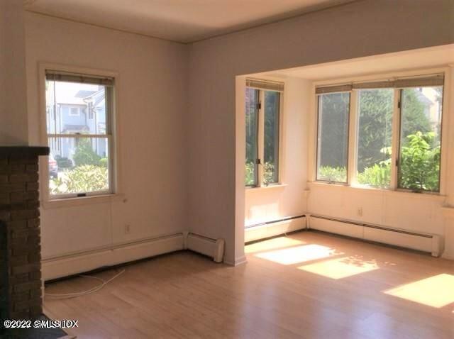 83 William Street, Unit 1 Greenwich, CT 06830 - Photo 8 of 10 an empty room with a empty space and windows