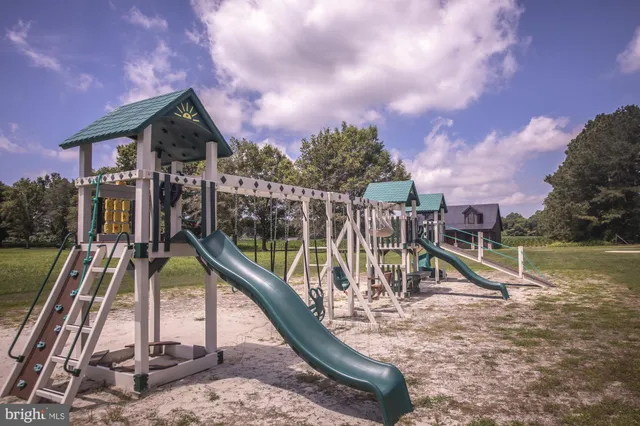 a bathroom with a toilet a sink and a mirror