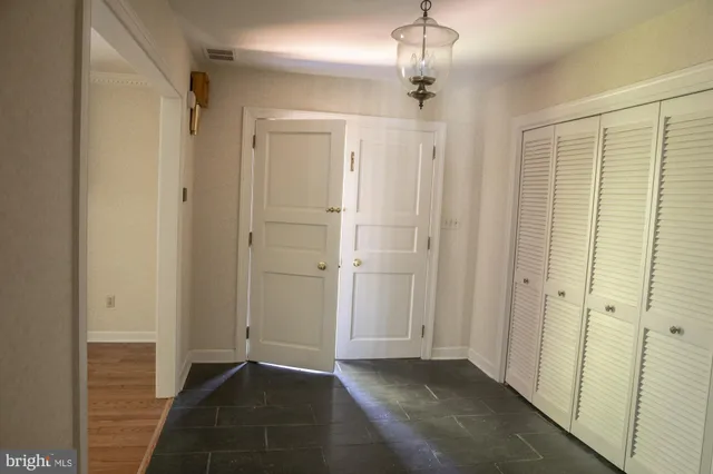 a view of hallway with windows