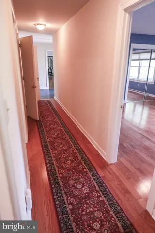 a bathroom with a sink and mirror with toilet