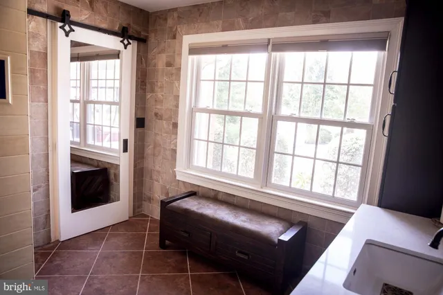 an empty room with wooden floor and closet