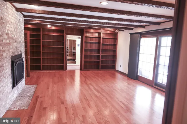 a view of an empty room with a large window