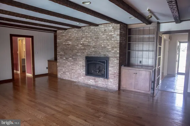 a view of a hallway with windows and stairs