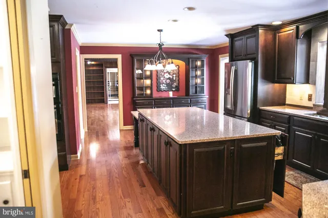 a view of a swimming pool with a garden and trees