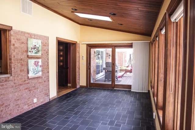 a bathroom with a toilet a sink and a mirror