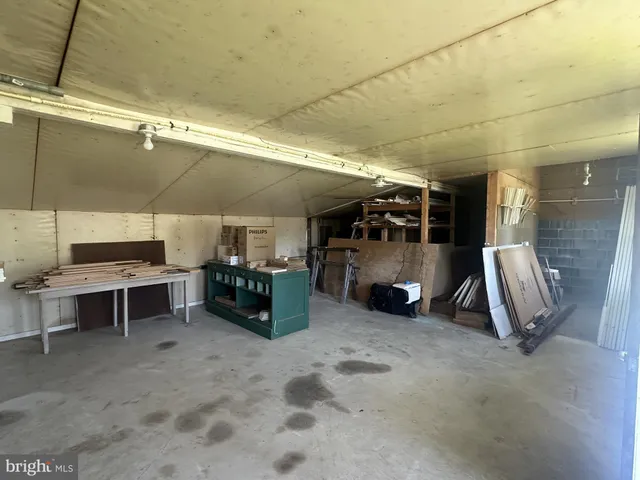 a kitchen with granite countertop cabinets stainless steel appliances and a counter space