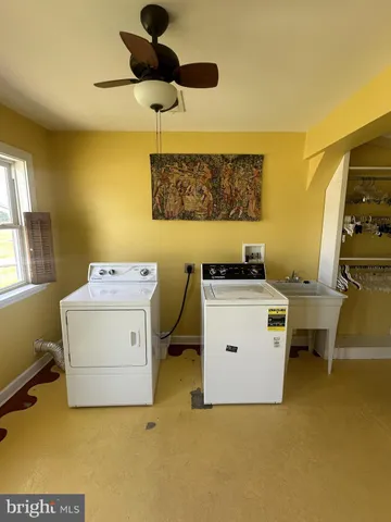a kitchen with stainless steel appliances wooden floor