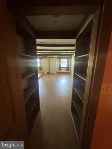 a view of a room with stairs and a large window