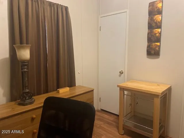 a bedroom with a bed and a mirror